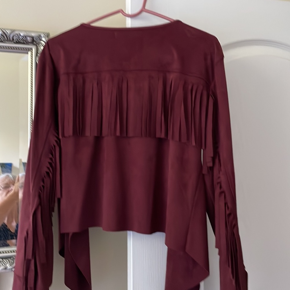 Casual maroon fringed jacket.